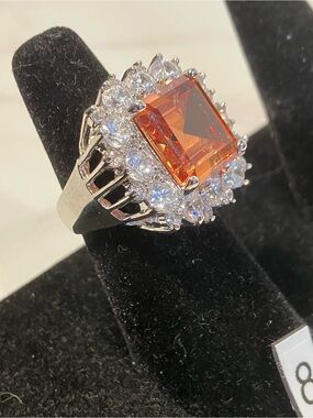 Striking Peach Center Stone and Cubic zirconia Halo ‘Peach Bellini